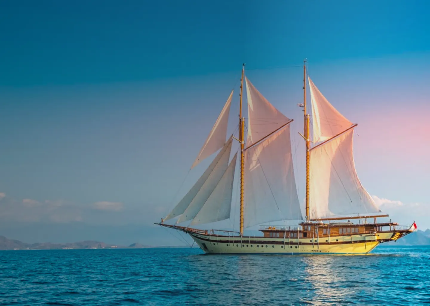 a Phinisi boat cruise the ocean